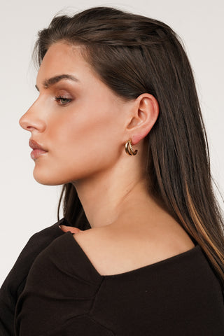 Halve oorringen met twist goud - Dilaya
