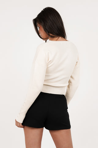 Stretch top met drukknoopjes creme - Florine